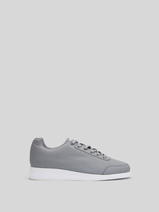Grey Leather Luxury Fashion Portal GL Mens Sneaker Luxury white full‑grain leather sneakers by JuMclu Portal, handcrafted limited‑edition design with premium four‑layer outsole and exclusive artisanal detailing. Right JuMclu Black Suede Luxury Fashion Men’s Portal Sneaker — premium black suede men’s designer sneaker with full‑grain detailing, handcrafted outsole, luxury streetwear silhouette, high‑end fashion footwear, exclusive JuMclu Portal men’s shoe, premium suede upper, industrial design accents, 