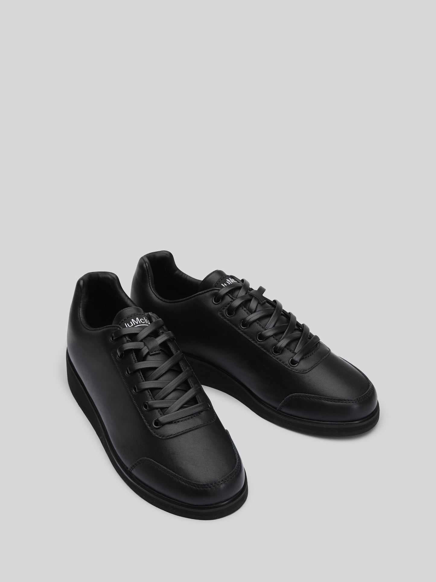 JuMclu Black Leather Luxury Fashion Portal Sneaker — left‑foot promotional prototype, premium full‑grain leather, rare deadstock exclusive edition, dressy high‑end trainers for luxury streetwear shoppers. JuMclu Portal Prototype black leather luxury fashion sneaker, left‑foot promotional edition, crafted in premium full‑grain leather with rare deadstock detailing, exclusive dressy silhouette, discount‑release trainers engineered for elevated style and high‑end streetwear appeal.